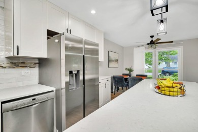 At first glance, this brick and sided split-level home may on Ravisloe Country Club in Illinois - for sale on GolfHomes.com, golf home, golf lot