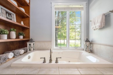 Welcome to this stunning 4-bedroom, 4-bathroom home situated on on Boulder Creek Golf Club in Michigan - for sale on GolfHomes.com, golf home, golf lot