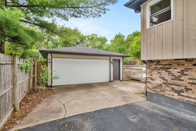 At first glance, this brick and sided split-level home may on Ravisloe Country Club in Illinois - for sale on GolfHomes.com, golf home, golf lot