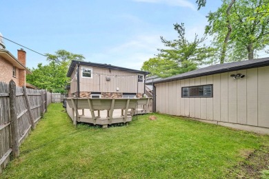 At first glance, this brick and sided split-level home may on Ravisloe Country Club in Illinois - for sale on GolfHomes.com, golf home, golf lot