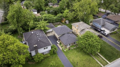At first glance, this brick and sided split-level home may on Ravisloe Country Club in Illinois - for sale on GolfHomes.com, golf home, golf lot