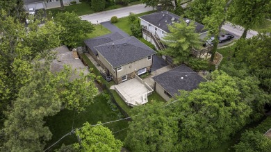 At first glance, this brick and sided split-level home may on Ravisloe Country Club in Illinois - for sale on GolfHomes.com, golf home, golf lot