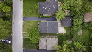 At first glance, this brick and sided split-level home may on Ravisloe Country Club in Illinois - for sale on GolfHomes.com, golf home, golf lot
