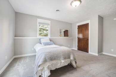 Welcome to this stunning 4-bedroom, 4-bathroom home situated on on Boulder Creek Golf Club in Michigan - for sale on GolfHomes.com, golf home, golf lot
