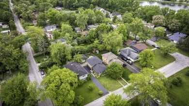 At first glance, this brick and sided split-level home may on Ravisloe Country Club in Illinois - for sale on GolfHomes.com, golf home, golf lot