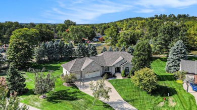 Welcome to this stunning 4-bedroom, 4-bathroom home situated on on Boulder Creek Golf Club in Michigan - for sale on GolfHomes.com, golf home, golf lot