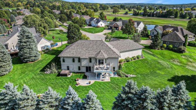 Welcome to this stunning 4-bedroom, 4-bathroom home situated on on Boulder Creek Golf Club in Michigan - for sale on GolfHomes.com, golf home, golf lot