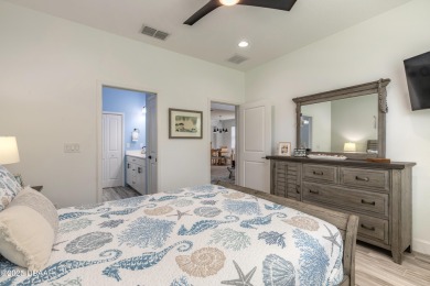 Discover the perfect blend of comfort and charm in this on LPGA International Golf Course in Florida - for sale on GolfHomes.com, golf home, golf lot