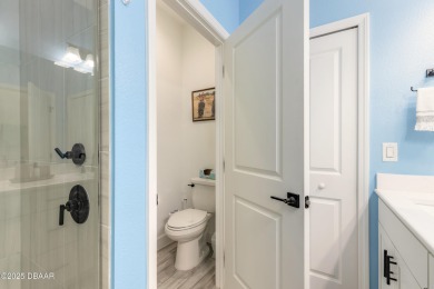 Discover the perfect blend of comfort and charm in this on LPGA International Golf Course in Florida - for sale on GolfHomes.com, golf home, golf lot