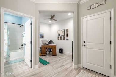 Discover the perfect blend of comfort and charm in this on LPGA International Golf Course in Florida - for sale on GolfHomes.com, golf home, golf lot