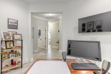 Discover the perfect blend of comfort and charm in this on LPGA International Golf Course in Florida - for sale on GolfHomes.com, golf home, golf lot