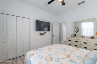 Discover the perfect blend of comfort and charm in this on LPGA International Golf Course in Florida - for sale on GolfHomes.com, golf home, golf lot