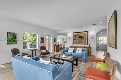 Light-filled and move-in ready, this walled and gated corner-lot on La Gorce Country Club in Florida - for sale on GolfHomes.com, golf home, golf lot