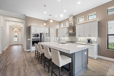 Crafted by Cardel Homes and positioned behind the gates of on Ritz-Carlton Members Golf Club in Florida - for sale on GolfHomes.com, golf home, golf lot