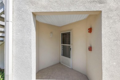 This ground-floor, 2-bedroom, 2-bath condo in Isla Del Sol on Isla Del Sol Yacht and Country Club in Florida - for sale on GolfHomes.com, golf home, golf lot