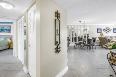 This ground-floor, 2-bedroom, 2-bath condo in Isla Del Sol on Isla Del Sol Yacht and Country Club in Florida - for sale on GolfHomes.com, golf home, golf lot