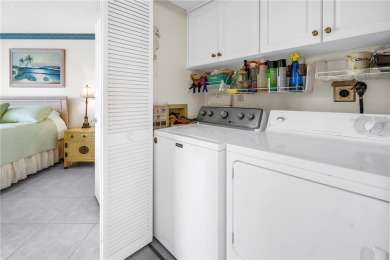 This ground-floor, 2-bedroom, 2-bath condo in Isla Del Sol on Isla Del Sol Yacht and Country Club in Florida - for sale on GolfHomes.com, golf home, golf lot