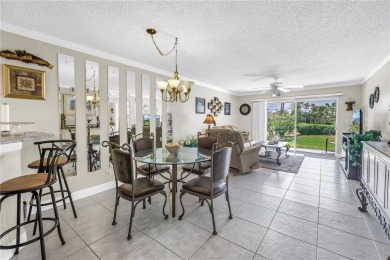 This ground-floor, 2-bedroom, 2-bath condo in Isla Del Sol on Isla Del Sol Yacht and Country Club in Florida - for sale on GolfHomes.com, golf home, golf lot