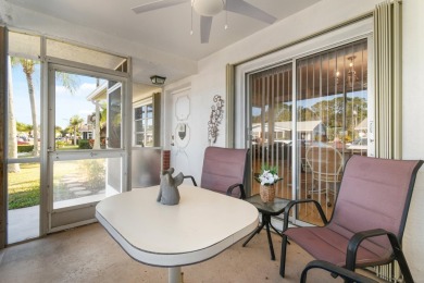 Delightful one level townhouse with step saving kitchen and 2 on Cypress Lakes Golf Course - West Palm Beach in Florida - for sale on GolfHomes.com, golf home, golf lot
