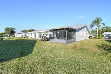 Delightful one level townhouse with step saving kitchen and 2 on Cypress Lakes Golf Course - West Palm Beach in Florida - for sale on GolfHomes.com, golf home, golf lot