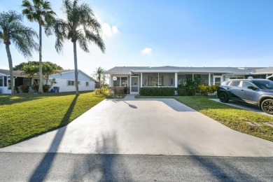Delightful one level townhouse with step saving kitchen and 2 on Cypress Lakes Golf Course - West Palm Beach in Florida - for sale on GolfHomes.com, golf home, golf lot
