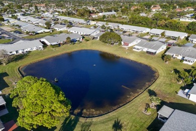 Delightful one level townhouse with step saving kitchen and 2 on Cypress Lakes Golf Course - West Palm Beach in Florida - for sale on GolfHomes.com, golf home, golf lot