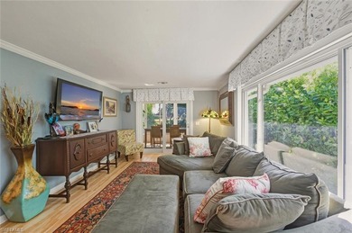 This tropical oasis features an updated interior, lush on Riviera Golf Club in Florida - for sale on GolfHomes.com, golf home, golf lot