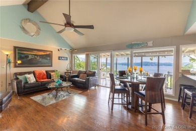 Vacation vibes meet everyday living in this stunning lakefront on The Oaks Golf Course in Missouri - for sale on GolfHomes.com, golf home, golf lot