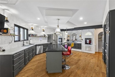 Experience the WOW factor of this beautiful lakefront property on Lakewood Oaks Golf Club, Ltd. in Missouri - for sale on GolfHomes.com, golf home, golf lot