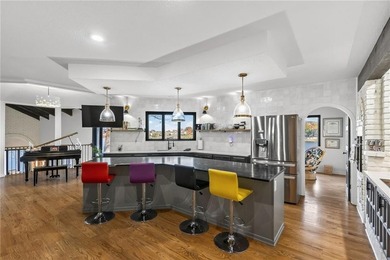 Experience the WOW factor of this beautiful lakefront property on Lakewood Oaks Golf Club, Ltd. in Missouri - for sale on GolfHomes.com, golf home, golf lot