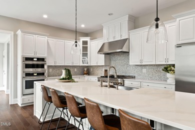 From holiday dinners to movie nights, this home was made for on Hasentree Club in North Carolina - for sale on GolfHomes.com, golf home, golf lot