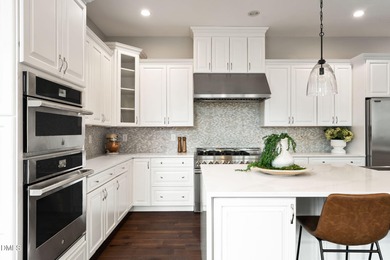 From holiday dinners to movie nights, this home was made for on Hasentree Club in North Carolina - for sale on GolfHomes.com, golf home, golf lot