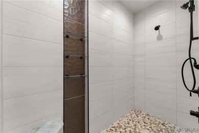 This stunning 5,500 sq ft home offers an exceptional blend of on The Club At Porto Cima in Missouri - for sale on GolfHomes.com, golf home, golf lot