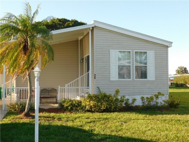 This 2005 Cavalier home is situated on a spacious lot on a on Barefoot Bay Golf Course in Florida - for sale on GolfHomes.com, golf home, golf lot