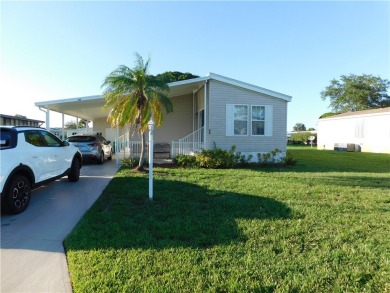 This 2005 Cavalier home is situated on a spacious lot on a on Barefoot Bay Golf Course in Florida - for sale on GolfHomes.com, golf home, golf lot