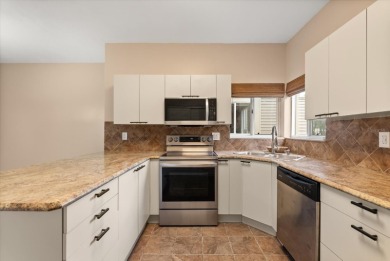 Beautiful corner condominium with serene pond views located in on Plantation Bay Golf and Country Club in Florida - for sale on GolfHomes.com, golf home, golf lot