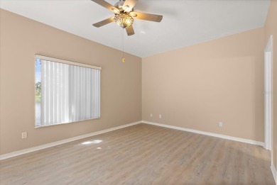 Beautiful corner condominium with serene pond views located in on Plantation Bay Golf and Country Club in Florida - for sale on GolfHomes.com, golf home, golf lot