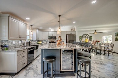 If you're looking for a gorgeous home in a gated golf community on Pine Lakes Country Club in Florida - for sale on GolfHomes.com, golf home, golf lot