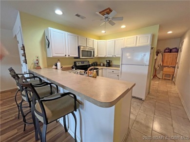 Come check out this spacious 3 bed, 2 bath lakefront condo at on Lake Valley Country Club in Missouri - for sale on GolfHomes.com, golf home, golf lot