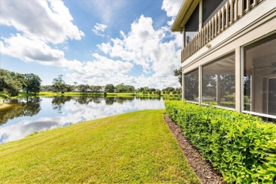 Beautiful corner condominium with serene pond views located in on Plantation Bay Golf and Country Club in Florida - for sale on GolfHomes.com, golf home, golf lot
