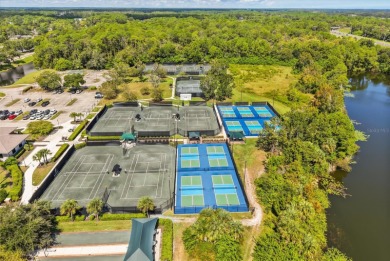 Beautiful corner condominium with serene pond views located in on Plantation Bay Golf and Country Club in Florida - for sale on GolfHomes.com, golf home, golf lot