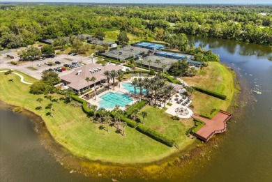 Beautiful corner condominium with serene pond views located in on Plantation Bay Golf and Country Club in Florida - for sale on GolfHomes.com, golf home, golf lot