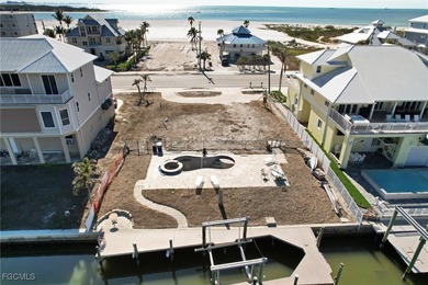 Located in the quaint boating community of Laguna Shores on Fort Myers Beach and Golf Club in Florida - for sale on GolfHomes.com, golf home, golf lot