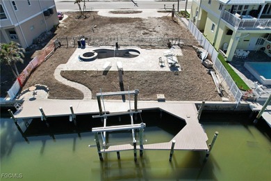 Located in the quaint boating community of Laguna Shores on Fort Myers Beach and Golf Club in Florida - for sale on GolfHomes.com, golf home, golf lot