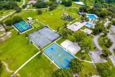 Beautiful views of 2 lakes from all the living areas in this 3 on Martin Downs Country Club in Florida - for sale on GolfHomes.com, golf home, golf lot