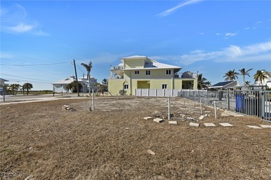 Located in the quaint boating community of Laguna Shores on Fort Myers Beach and Golf Club in Florida - for sale on GolfHomes.com, golf home, golf lot