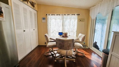 Nestled within the highly sought-after golf course community of on Blue Heron Pines Golf Course in Florida - for sale on GolfHomes.com, golf home, golf lot
