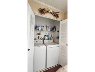 Nestled within the highly sought-after golf course community of on Blue Heron Pines Golf Course in Florida - for sale on GolfHomes.com, golf home, golf lot