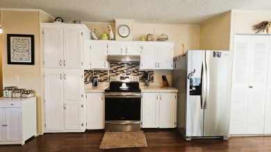 Nestled within the highly sought-after golf course community of on Blue Heron Pines Golf Course in Florida - for sale on GolfHomes.com, golf home, golf lot