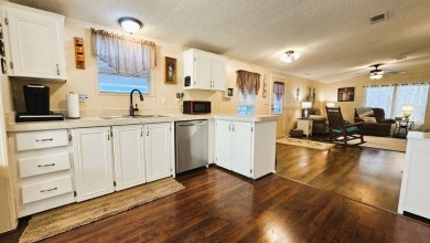 Nestled within the highly sought-after golf course community of on Blue Heron Pines Golf Course in Florida - for sale on GolfHomes.com, golf home, golf lot
